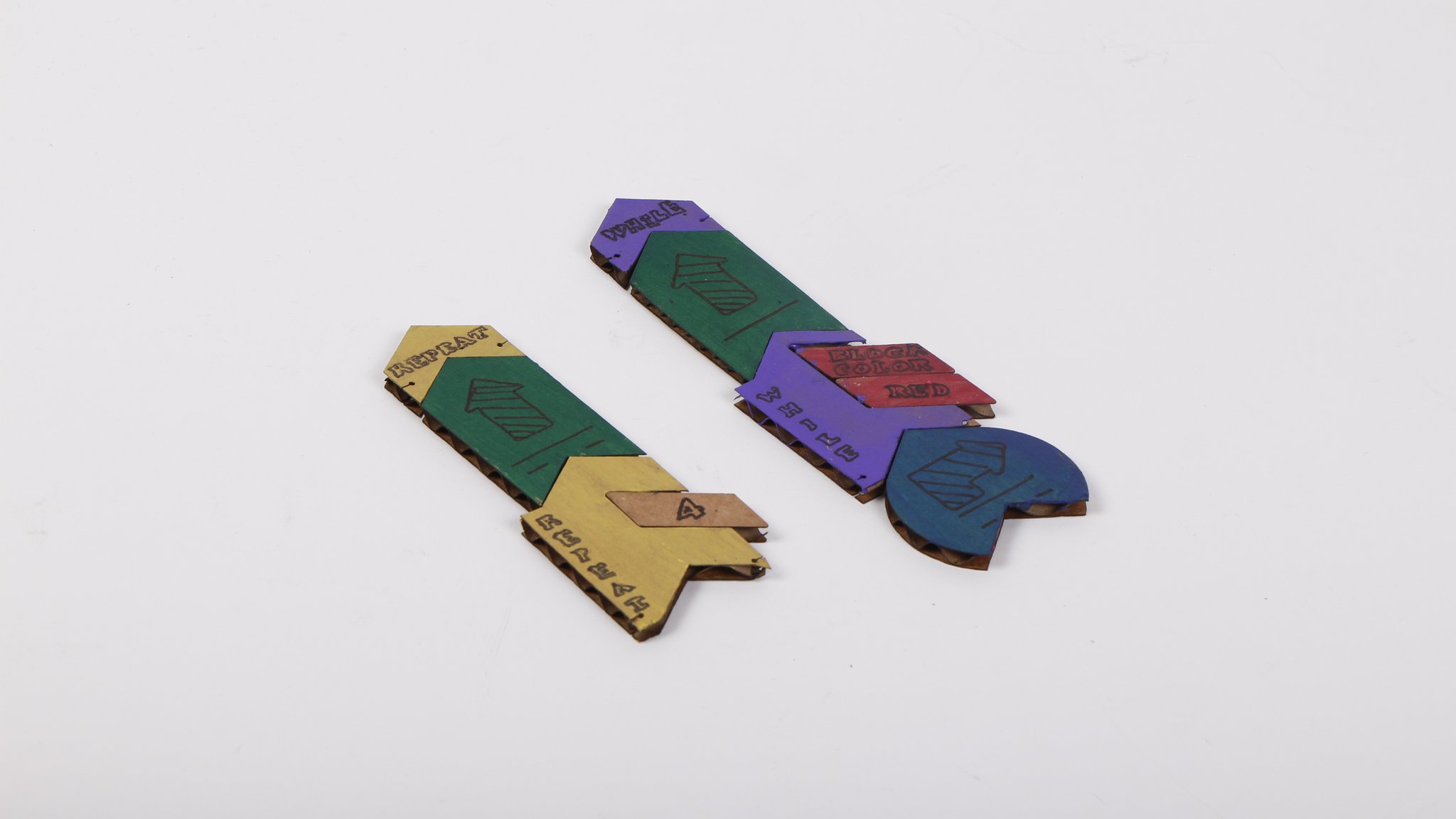 Collection of painted wooden tiles showing different color combinations